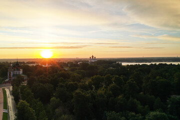 Fototapeta premium a panoramic view of the old fortress and church in the early morning at dawn filmed from a drone