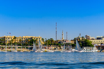 Different vessels near the bank of the Nile river in Luxor, Egypt.