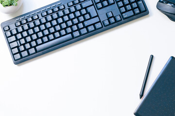 black keyboard, mouse, graphic tablet and stylus on white background