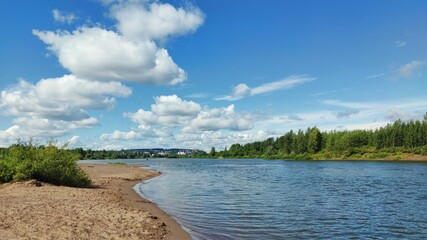 blue sky with clouds over the river on a sunny day