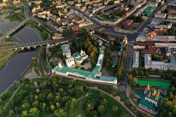 Fototapeta premium a panoramic view of the old fortress and church in the early morning at dawn filmed from a drone