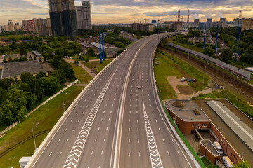 panoramic view of the morning city with roads, cars and junctions