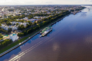 Fototapeta premium a large city with churches from the embankment along the river filmed from a drone
