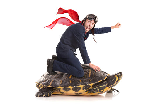 Businessman riding a turtle