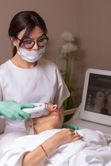 Lifting by ultrasound using a special cosmetology device. Smoothing wrinkles on the face with ultrasound