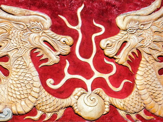 golden chinese dragon on red background
