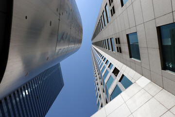 Fototapeta premium Skyscrapers from below against blue sky in LA