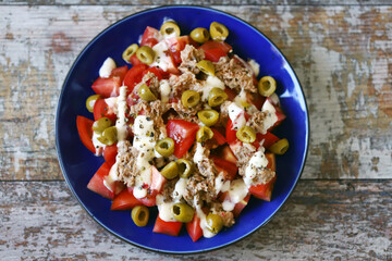 Salad with tuna, olives and tartar sauce. Healthly food. Fitness salad.