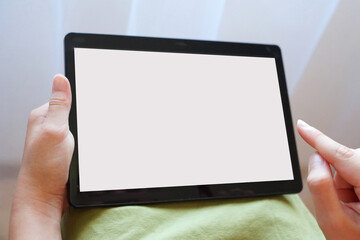 tablet with white screen in female hands, mock up
