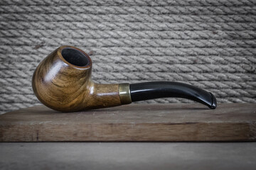 Wooden smoking pipe. Smoking habit. Device for smoking tobacco. Harm to health by smoking. Bad...