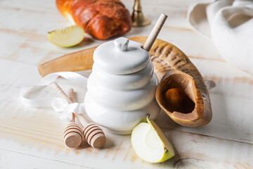 Shofar with honey and apple on table. Rosh Hashanah (Jewish New Year) celebration