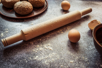 ingredients for making baking bread and rolls lie on a gray table 1