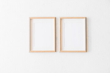 Empty photo frames hanging on wall in room