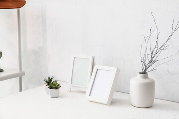 Photo frames on table in room