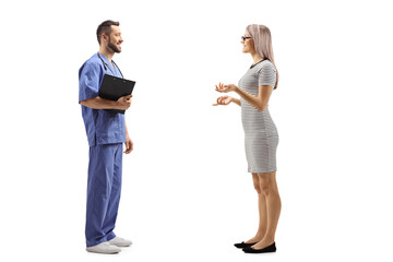 Young woman talking to a male healthcare worker