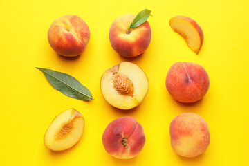 Many ripe peaches on color background