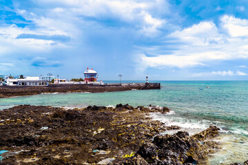 Arrieta, Lanzarote, Canary Islands / Spain - March 10, 2011: View of the waterfront with the Blue House (Casa Juanita)