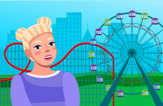 Positive young girl near ferris wheel with colored cabins and a roller coaster ride amid large city buildings. Pretty woman in attraction in amusement park, entertainment and leisure at weekends