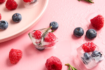 Ice with frozen berries on color background