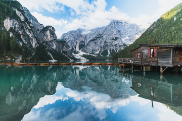 Picturesque view on boathouse at beautiful mountain lake Lago di braies with wooden boats in the Dolomites,Italy