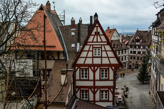 View of square Tiergaertnertorplatz with Pilatushaus building and restaurant Albrecht Duerer Haus, Nuremberg, Germany.