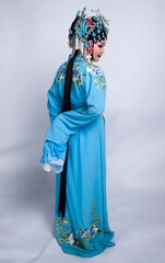 The veteran actors of Asian Peking Opera wear blue costumes