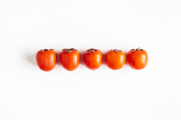 Persimmon fruit on white background. Flat lay, top view