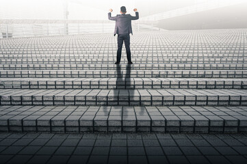 businessman happy on stairs