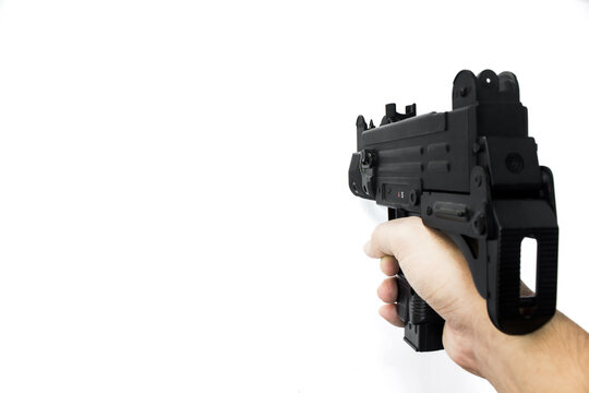 Close up of automatic mini machine uzi toy gun isolated on white background