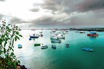 Orzola, Lanzarote, Canary Islands / Spain - March 10, 2011: Boats at the natural harbor
