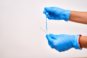 Doctor's hands in blue gloves collecting tests for testing