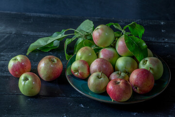 image of new crop apples on an old table
