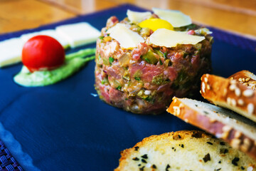 tasty Steak tartare (Raw beef) - classic steak tartare on white plate