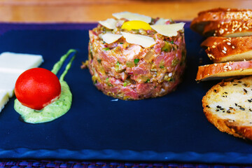 tasty Steak tartare (Raw beef) - classic steak tartare on white plate