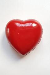 Shiny red heart on white background 
