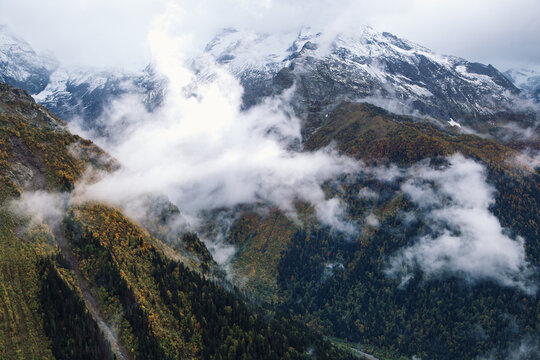 Fog in the mountains, scenic view from the Mount Mussa Achitara in Dombay ski resort in autumn season, Caucasus, Russia