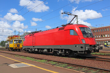 Fototapeta na wymiar Red railroad engine on the track