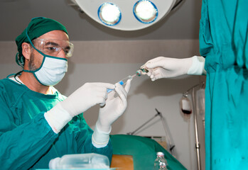 Anesthesiologist or doctor hold syringe prepare for injection in operating theatre,Epidural...