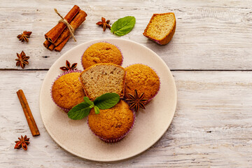 Homemade cupcakes with cinnamon, star anise and fresh mint. Autumn good mood, warm weather