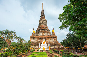 Fototapeta premium Buddha statues in front of the Stupa at Wat Yai Chai Mongkhon , Ayutthaya, Thailand, Unesco World Heritage Site