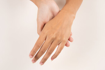 Obraz premium beautiful woman hands applying moisturizing cream to her skin