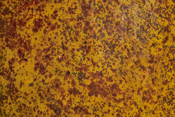 Brown, black and yellow rust on white enamel. Rusted brown and white abstract texture. Corroded white metal background. Rusted white painted metal wall. Rusty metal surface with streaks of rust.