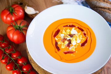 Traditional spanish Salmorejo. Cold tomato soup made with garlic, tomatoes, onion, bread and served...