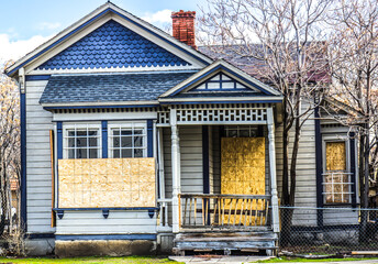 Old Boarded Up Home From Recession