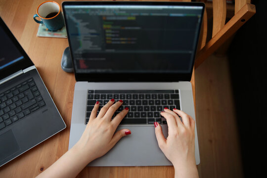 remotely running software writes code in the home office. remote operation due to corona virus.