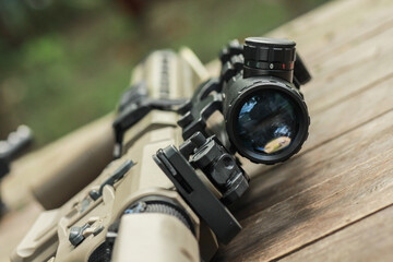 Military AR15 automatic assault rifle weapon with aim sight and flashlight
