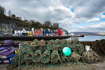 Lobster traps on a quay wall in the quaint town of Tobermory.