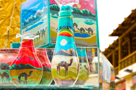 Sharm El Sheikh, Egypt - April 13, 2017: Decorative Glass Bottles with Colored Sand Inside