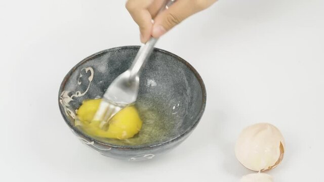 Food, Slow motion of hand shef Whisking the Egg for omelet or other cooking purpose