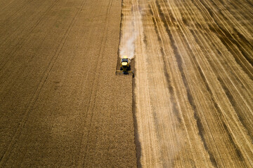 Yellow harvester in wheat field